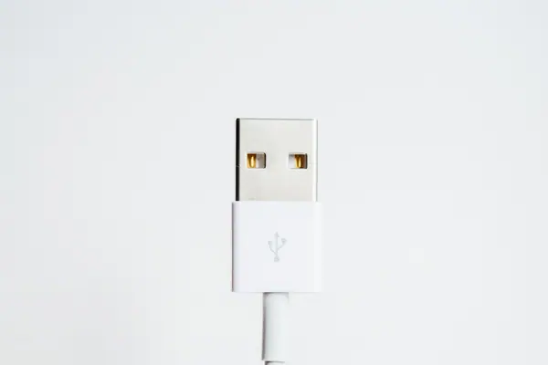 A white USB-A cable connector against a light background