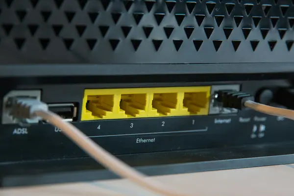 A router with Ethernet cables connected at the rear